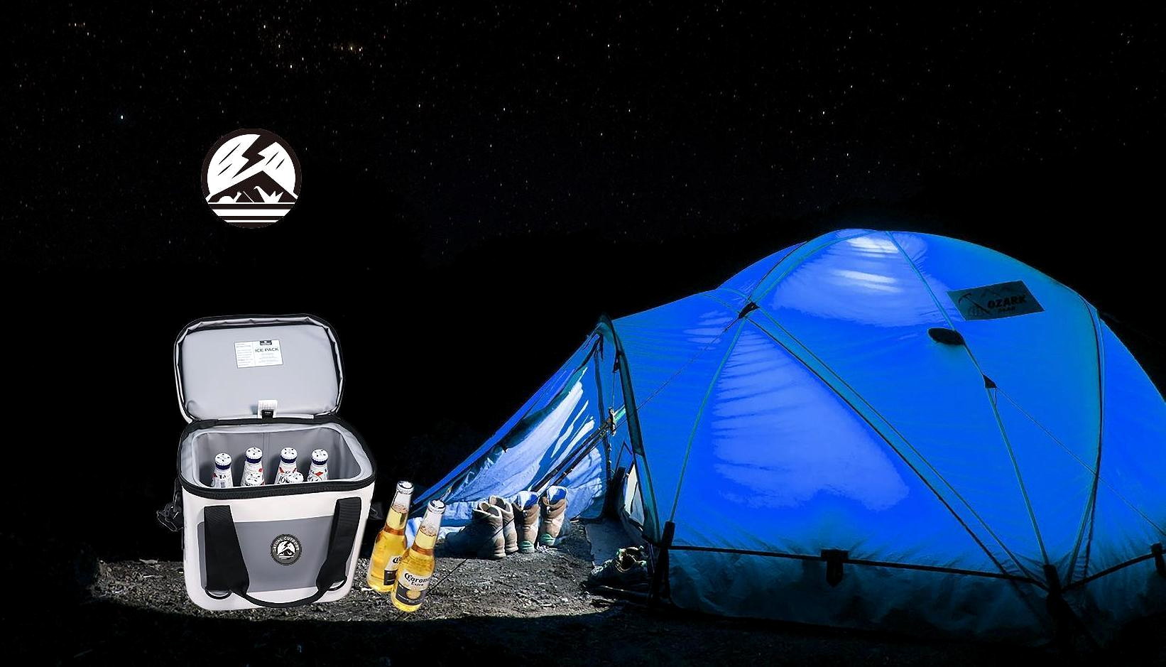 Night camping scene with NATURE OUTDOOR cooler bag beside a blue tent